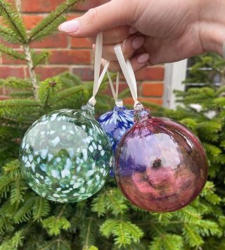 Langham Glass, Fakenham 🥽

We were lucky enough to be invited to make our own baubles at Langham Glass last week and it was such a fascinating, fun and festive experience. 

The first thing we did was pick what we would like to make. There was a huge range of items you can make: a whiskey glass, baubles, icicles, candy canes, plates and much more. Once you pick your item you get it customise it which was my favourite part. You can pick what colour and if you are making a bauble, what design. Dotted, ribbed or plain. 

We got taken through to the workshop and teamed up with one of the glassmakers, who helps you make your item. The Glassmakers were so friendly and made the whole experience so enjoyable. For you to make the item, you blow through the tube under instructions and guidance. You are given a disposable mouthpiece. After that, the Glassmaker finishes the item and takes it away for setting and you can usually collect it the following day. 

While we were there we looked around the shop area, where you can see all the amazing animals, glasses, candle holders and so much more. We all purchased some of the glass mushrooms which we were obsessed with. There is also a fab cafe you can visit onsite to have a cake and coffee. 

We really loved our visit, and we cannot wait to return next Christmas to make more Christmas decorations and presents. A new Christmas tradition. 

From the 30th october to Easter 2024 they are open 7 days a week. Mon - Fri 11.15am - 3.45pm & Sat 10.15am - 4.45pm & Sun 10.15am - 3.45pm. Check their website for opening times over Christmas. You also must book online before your visit using the link below. 

We really recommend visiting - we LOVED it. Great for a family or friend trip. 

Link - Glassmaking Demonstration Tickets – Langham Glass